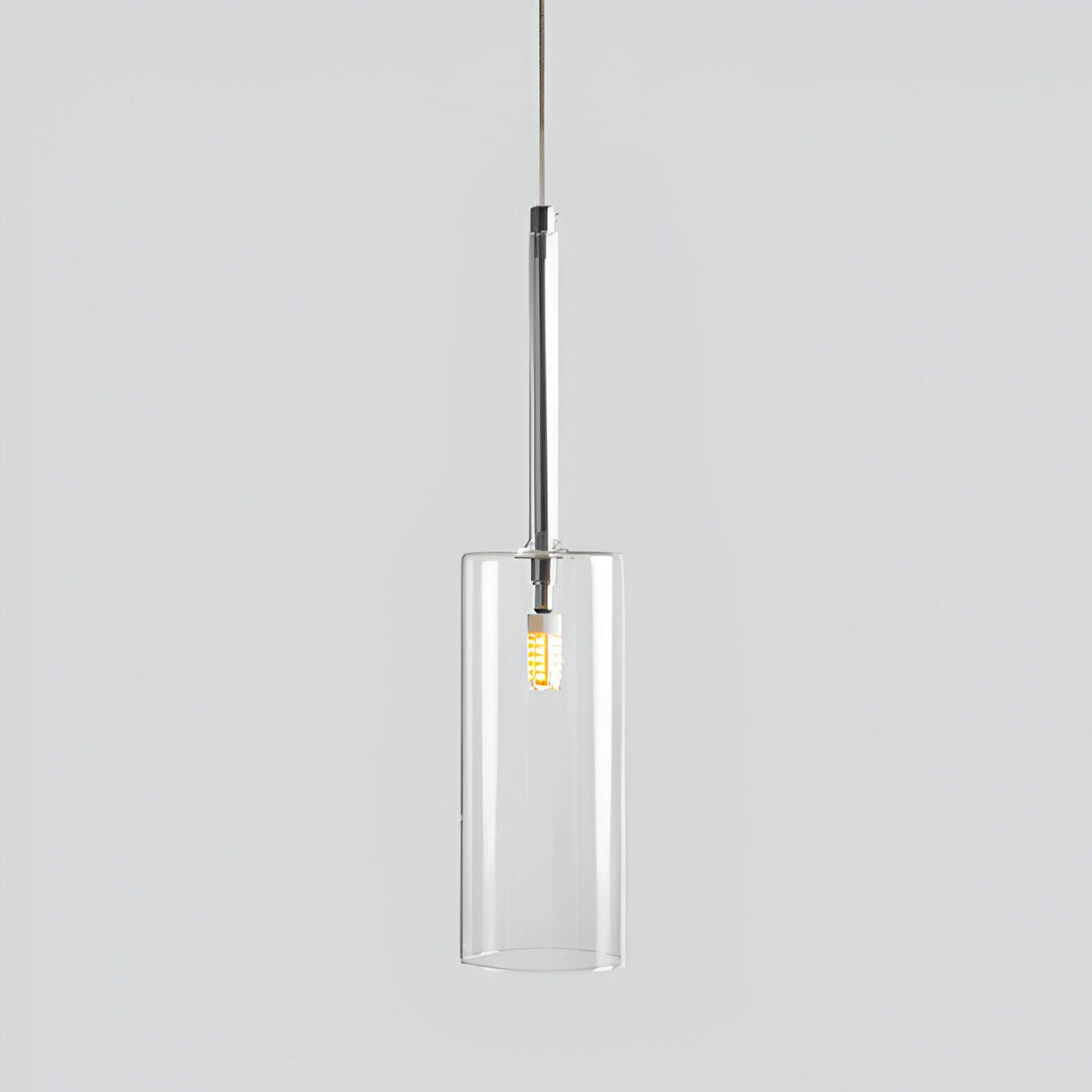 Une lampe suspendue industrielle avec un abat-jour en verre transparent et une douille en métal. La lampe est suspendue par un fil noir et est idéale pour une utilisation dans les cuisines, les salles à manger et les salons.