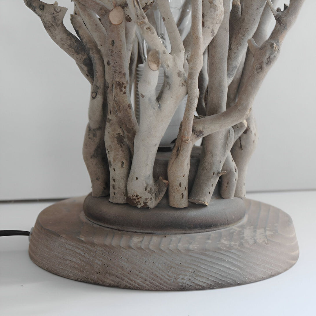 Une lampe en bois flotté avec une ampoule en forme de flamme. AR-5394209219,