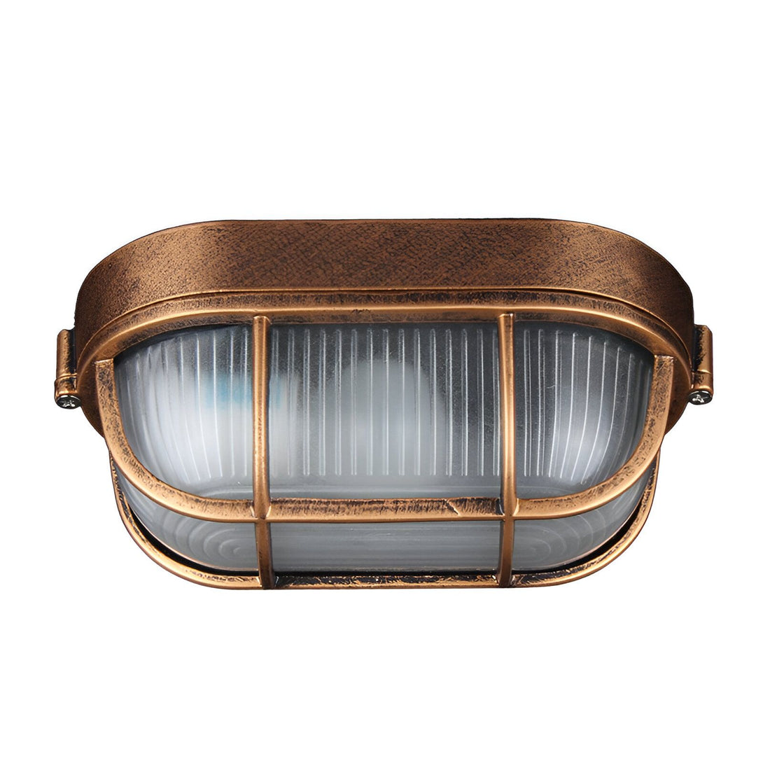 Une applique murale de style industriel avec une grille de protection en métal et un verre dépoli. La lampe est de couleur bronze et mesure 20 cm de long, 10 cm de haut et 15 cm de profondeur. LE-1239025416,