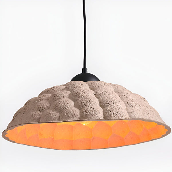 Une lampe en papier de forme ovale émettant une lumière orangée. NA-107721488X,