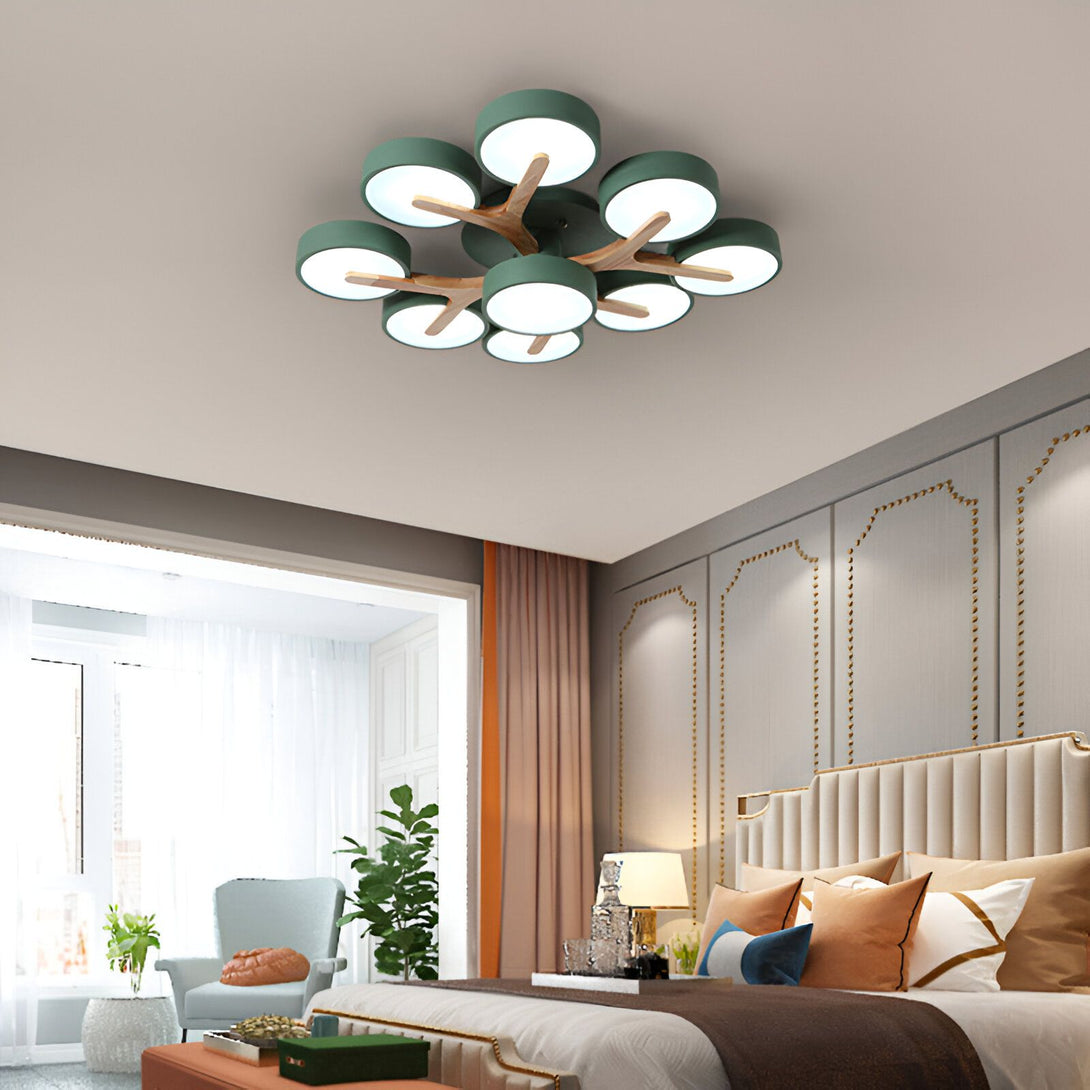 Un plafonnier LED vert en forme de fleur avec des branches en bois. Il y a sept lumières LED sur le plafonnier. PL-2355612153,PL-5660108733,PL-3743409283,PL-6047112455,PL-2411414536,PL-2840750430,