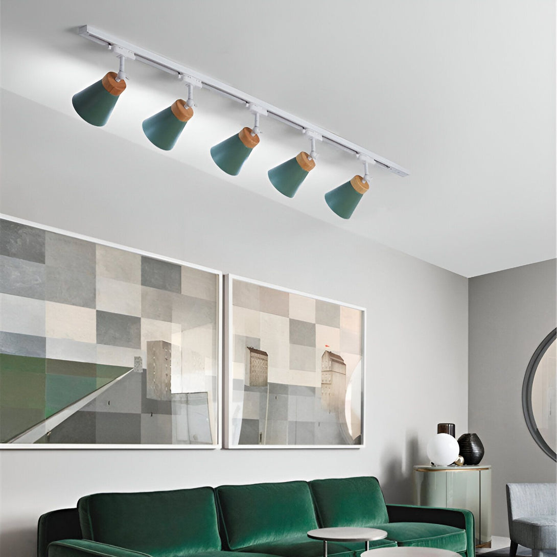Le luminaire Spot est un système d'éclairage sur rail qui permet d'orienter les spots indépendamment les uns des autres. Il est parfait pour mettre en valeur des objets ou des zones spécifiques d'une pièce. Ce luminaire est disponible en plusieurs couleurs et finitions, ce qui vous permet de l'adapter à votre intérieur.