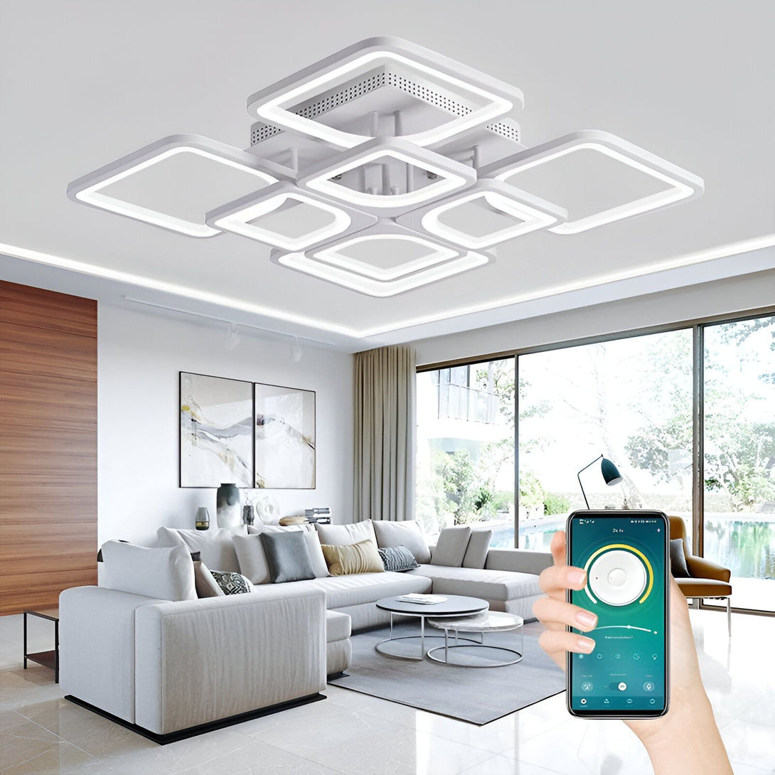 L'image montre un plafonnier LED carré encastré avec une application de contrôle. Il est composé de 5 carrés LED et d'un carré central avec une lumière LED. Le plafonnier est blanc et a une forme géométrique. Il est parfait pour un salon, une salle à manger ou une cuisine. LO-1375891898,LO-0522759459,